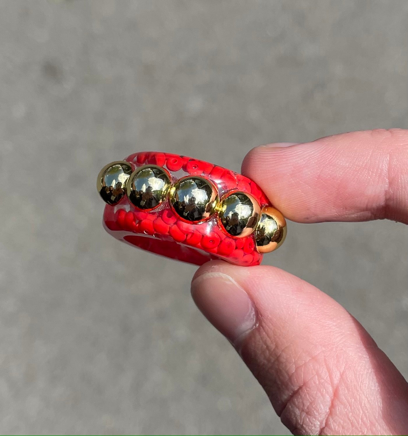 Red dotted gold bead ring